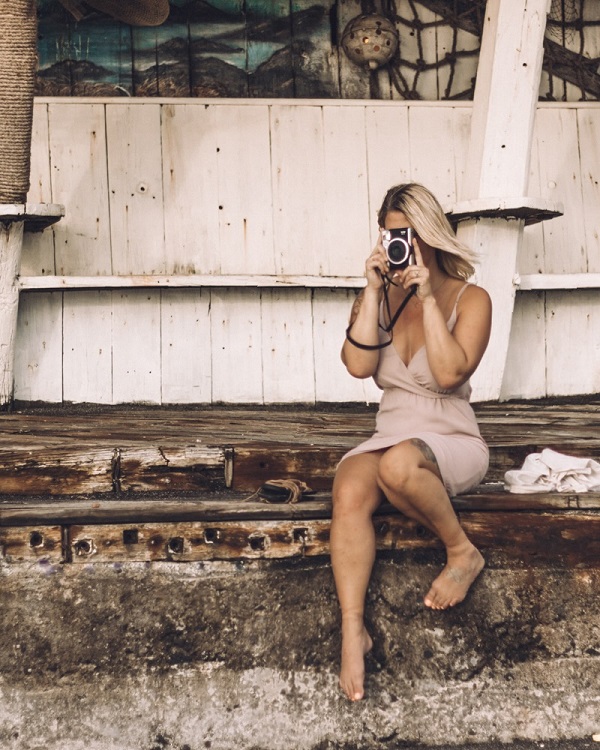girl holding camera