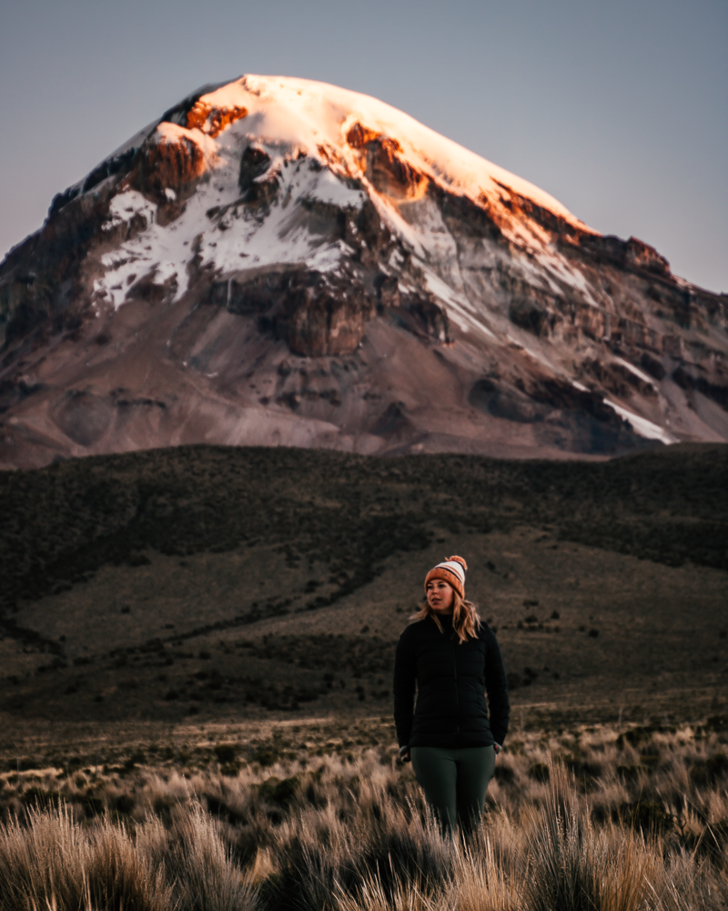jenn in front of a mountain at sunset